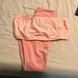 Soft pink Nike workout outfit.